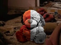 Teddy bear Baiji, June 2017 Everything was out  of place in this living room,  including this teddy  bear abandoned by its childowner. It lay amid debris,  covered with mud and dust.  The teddy is holding  a red heart with the word  “Love” written across it